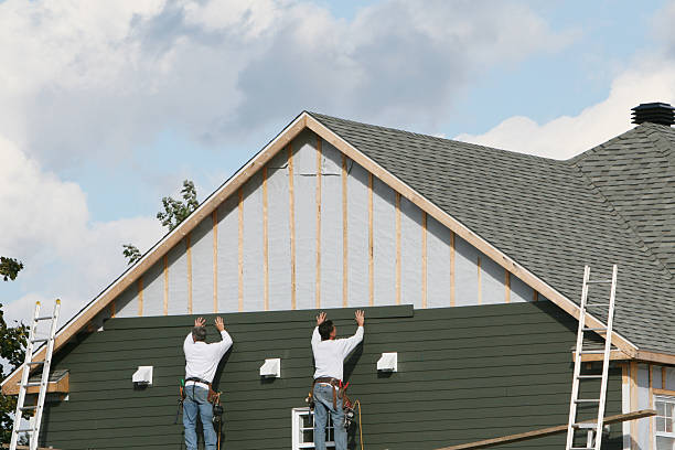 Professional Storm Damage Siding Repair technician working in Inverness, CO